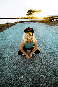 woman wearing sunglasses while taking photo thumbnail