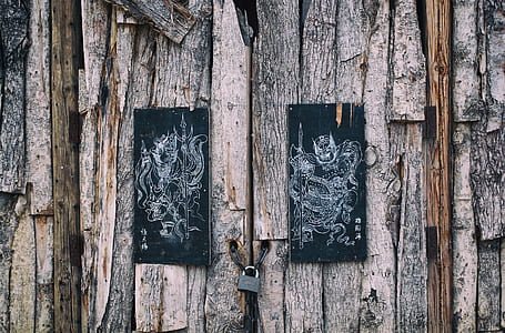 two rectangular black framed on logs thumbnail