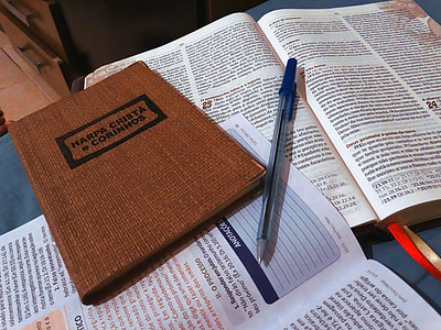 blue pencil beside Harpa Christa book thumbnail