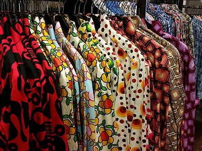 assorted collared tops on clothes hangers thumbnail
