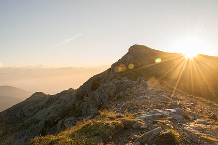 gray and green mountain top covers sunshine photo thumbnail