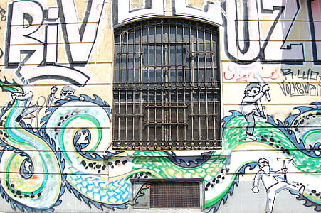graffiti wall with black meal window grill thumbnail
