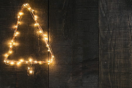 Tree Shaped Lights On Woodgrain Photo thumbnail