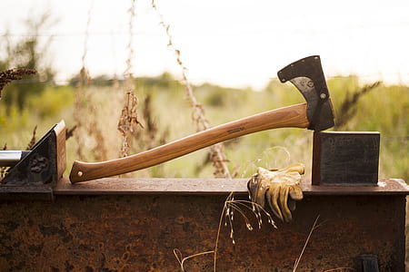 brown and black axe near yellow gloves thumbnail