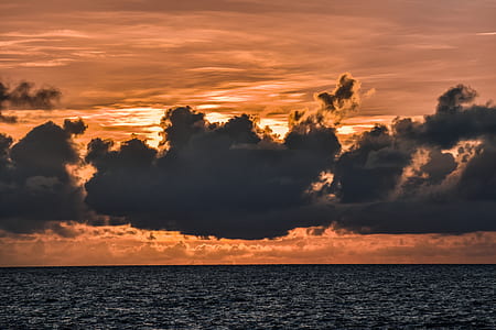 body of water during sunset thumbnail