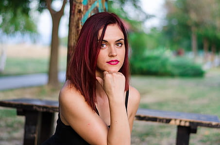 Woman in Black Tank Top Sitting on Bench thumbnail