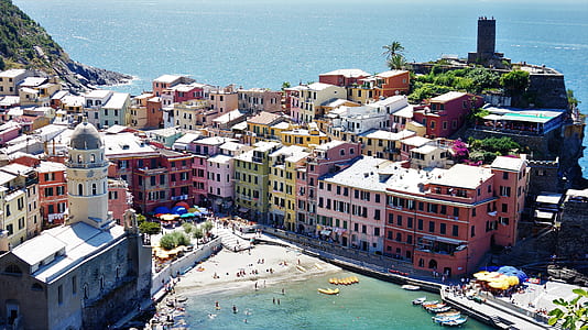 assorted-color concrete buildings surrounded ocean water thumbnail