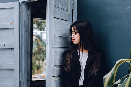 Woman Leaning Against Open Door thumbnail