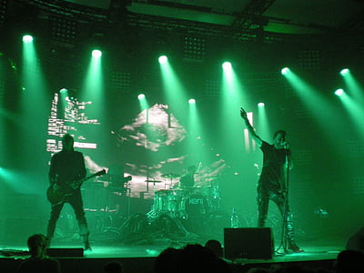 photo of male band performing concert on stadium thumbnail