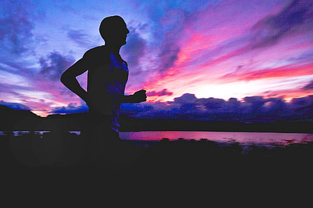 man wearing white tank top running on a sunset thumbnail