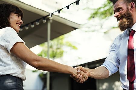 shallow focus photography of man and woman holding hands thumbnail
