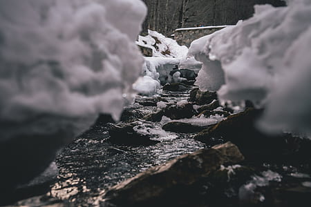 focus photography of river with rocks thumbnail