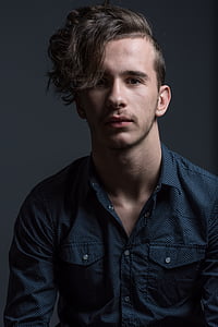 man wearing a blue top thumbnail