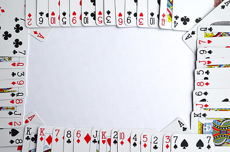 playing card lot on top of white table thumbnail