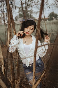 woman leaning on tree thumbnail