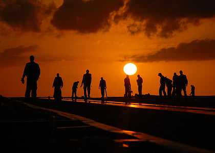 silhouette of people on road thumbnail