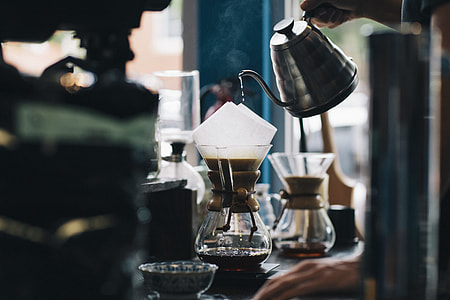 person pouring coffee on cup thumbnail