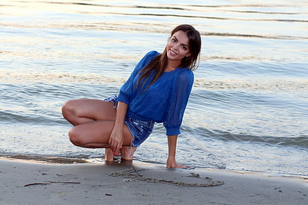 woman sitting on seashore thumbnail