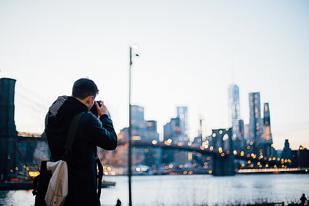 A photographer is taking photos of Manhattan thumbnail