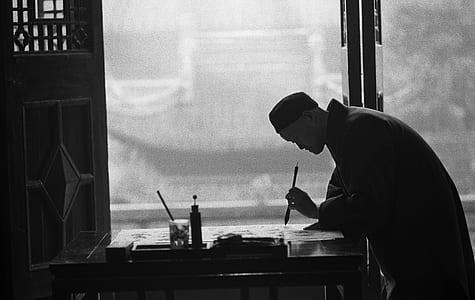 person writing on paper thumbnail