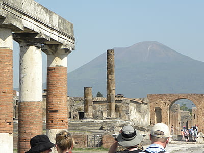 people near ruins under sunny sky thumbnail