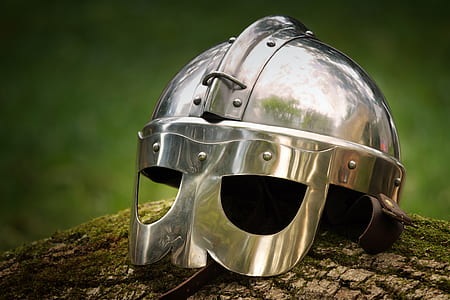 silver medieval helmet placed on stone thumbnail