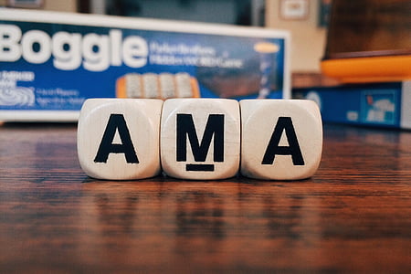 white AMA cube letters on wooden surface thumbnail