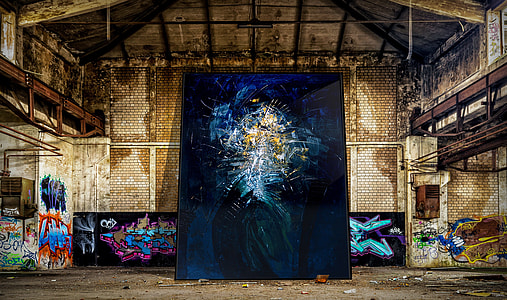 blue and beige painting leaning on wall thumbnail