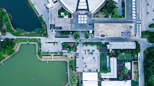 high angle photography of building and vehicle thumbnail