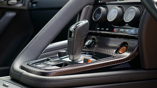 selective focus photography of vehicle gear shift lever thumbnail