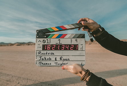 person holding cinema cut board thumbnail