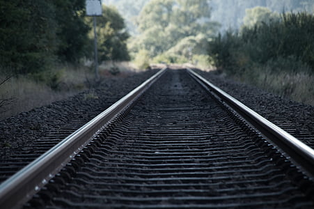 close-up photography of railroad at daytime thumbnail