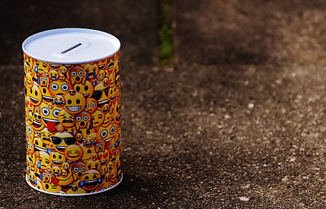 focus photo of coin bank on floor thumbnail
