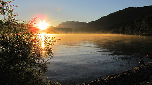 lake and mountain range during sunset thumbnail