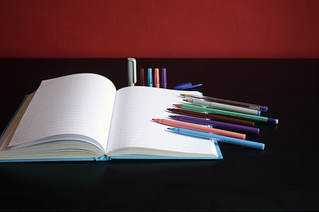 empty notebook with assorted-color pens thumbnail