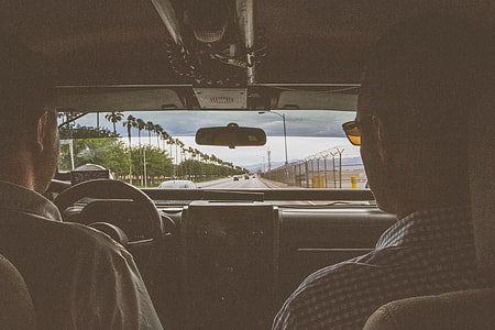 two man seating on car thumbnail
