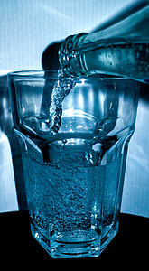 bottle pouring in clear drinking glass thumbnail