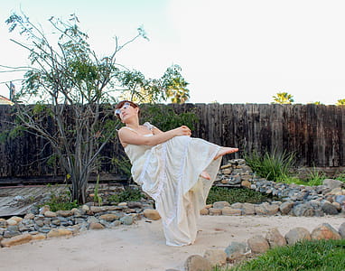 Woman Wearing White Spaghetti Strap Dress thumbnail