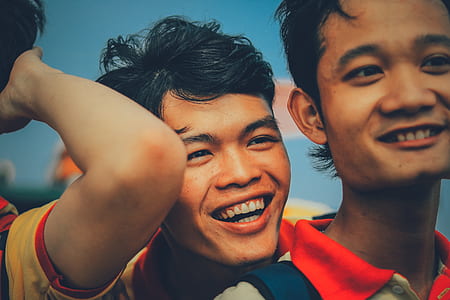 closeup photography of two smiling men thumbnail