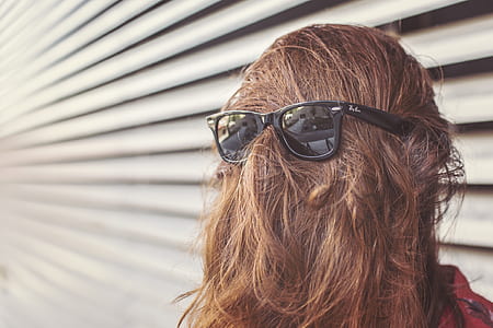 person wearing black Ran-Ban Wayfarer sunglasses thumbnail
