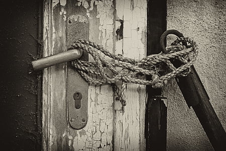 rope on door lever greyscale photography thumbnail