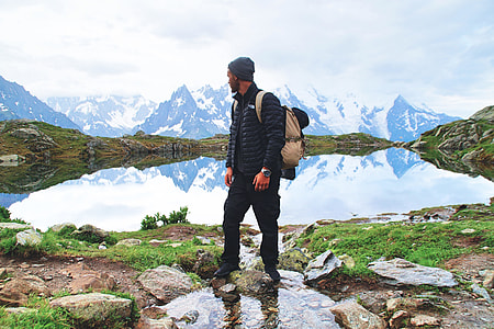 A man stands in the mountains in Chamonix, France thumbnail