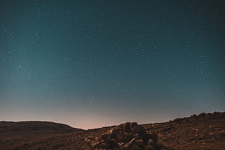 rock formation during nighttime thumbnail