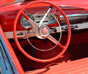 red vehicle steering wheel in close-up photo thumbnail