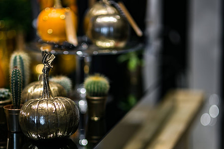 Golden ornamental pumpkins with cactuses thumbnail