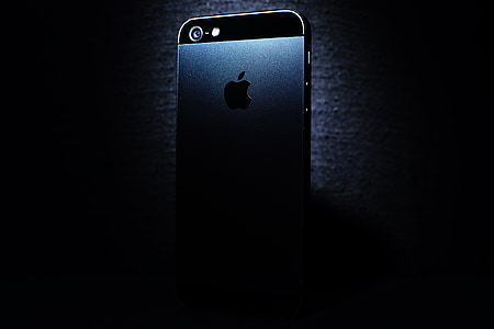 black iPhone 5 against black background thumbnail