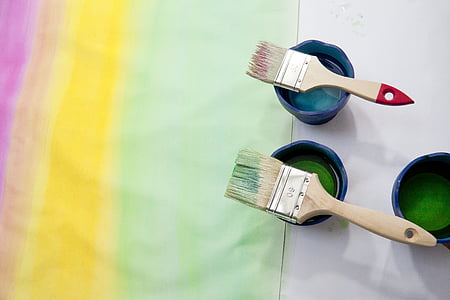 two brown paint brushes on can thumbnail
