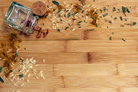 white rice grains on brown wooden board thumbnail