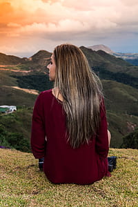 woman sitting on top of mountain thumbnail