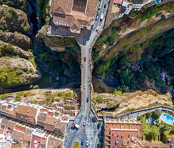 aerial photography of cars on bridge and houses at daytime thumbnail